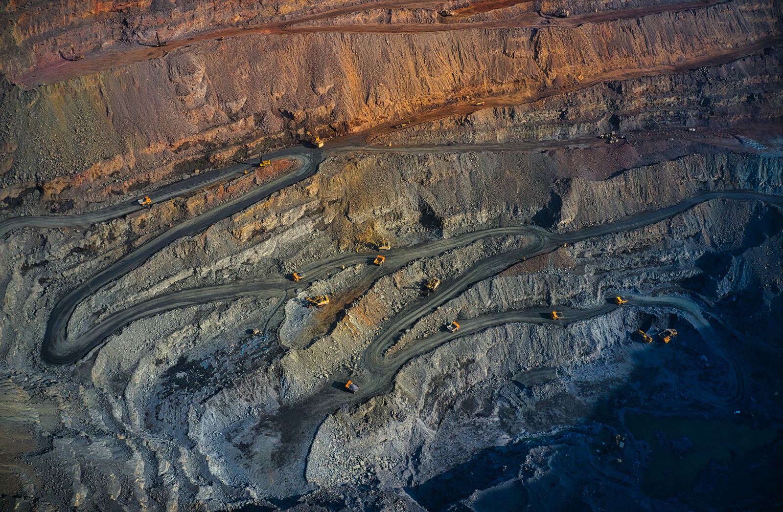 Aerial view of an open-pit mine with haul roads